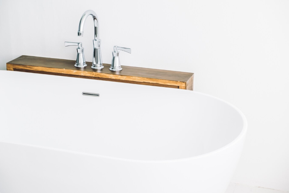 bathtub with deck mount faucet